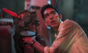 Chappie is still adorable in a batch of new stills